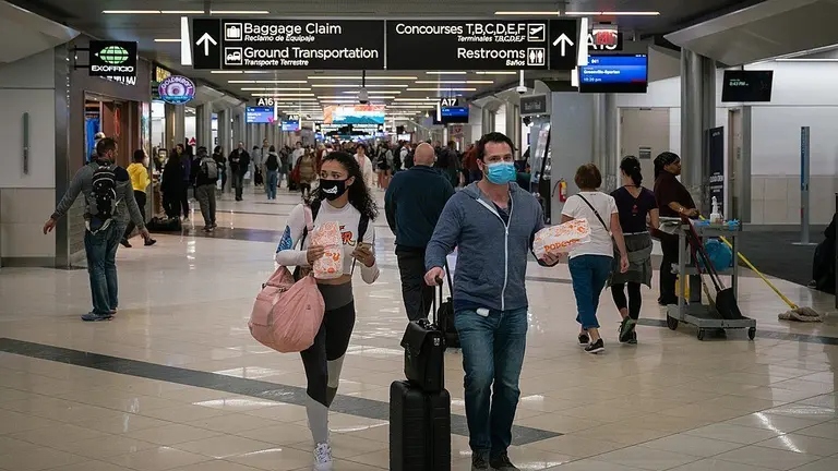 Flyers at Hartsfield-Jackson Atlanta International Airport wearing facemasks on March 6th, 2020 as the COVID-19 coronavirus spreads throughout the United States.